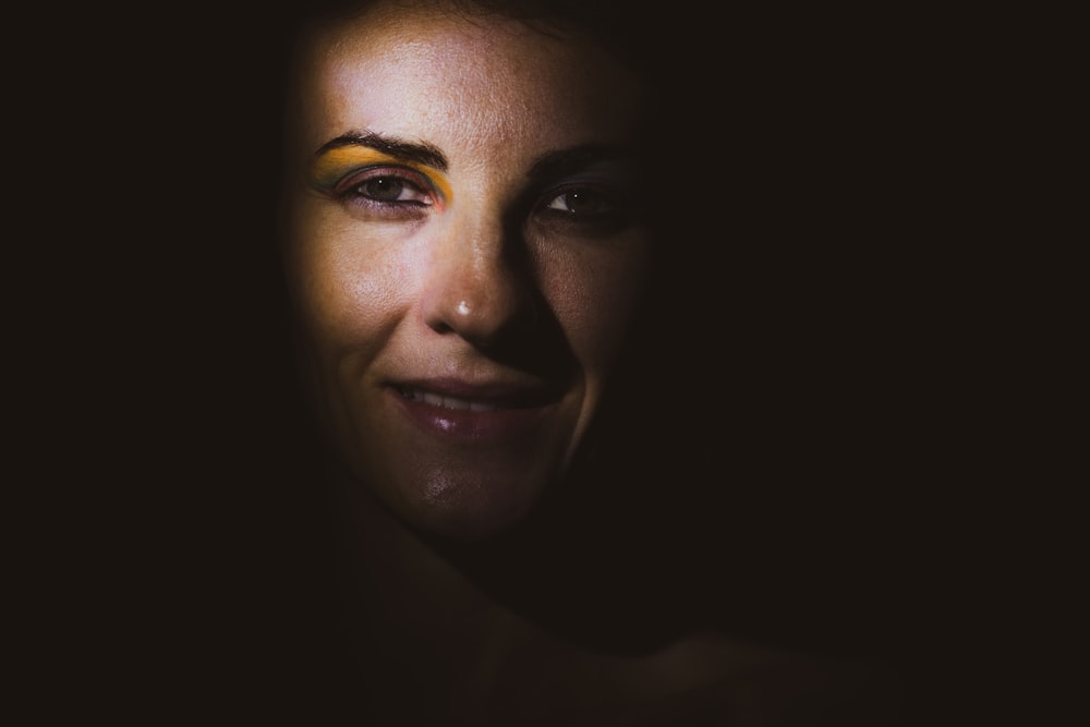 womans face with black background