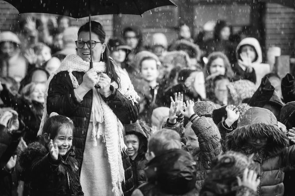 grayscale photo of people in the street