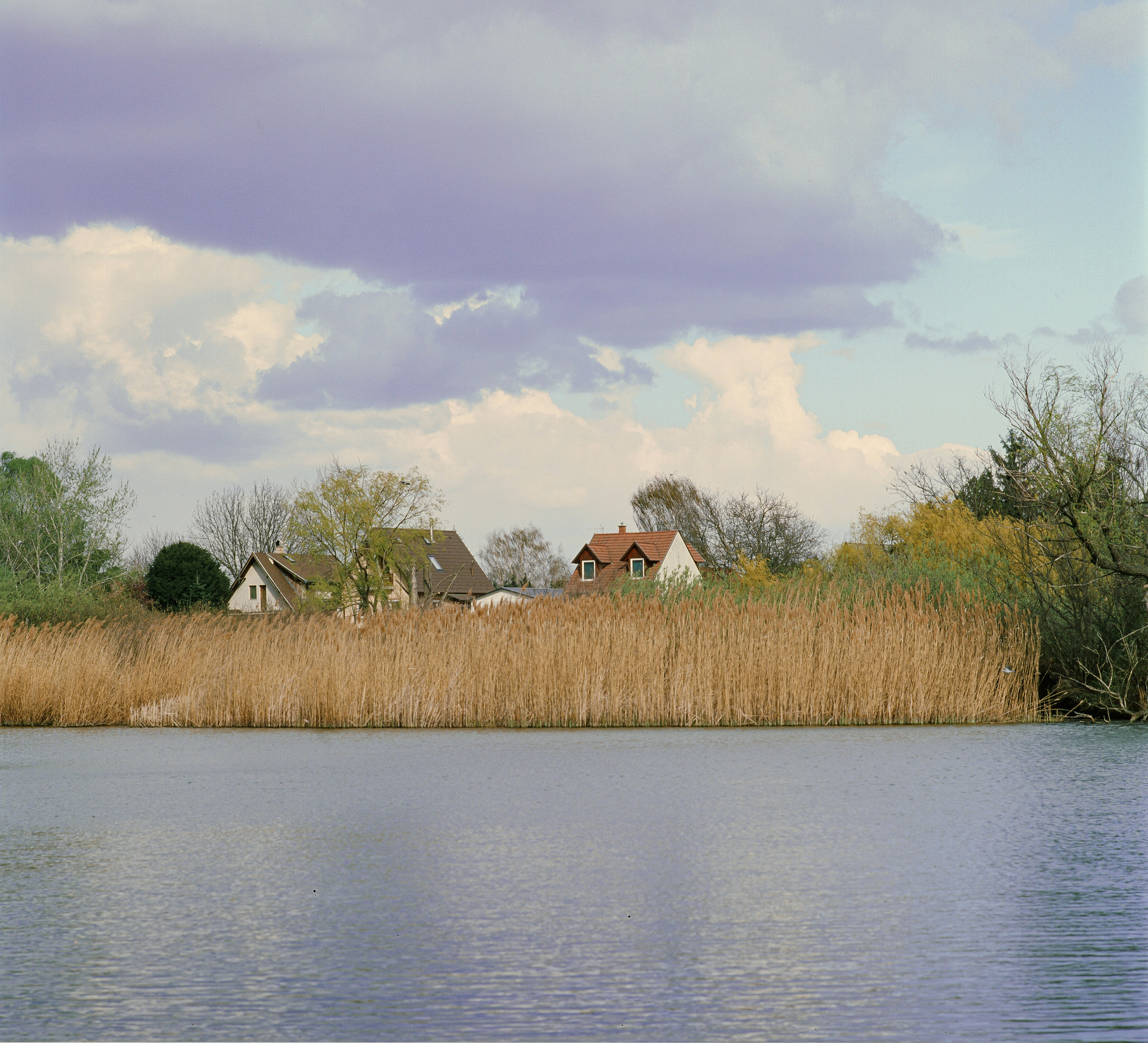 Brown and white house near body of water during daytime photo – Free ...