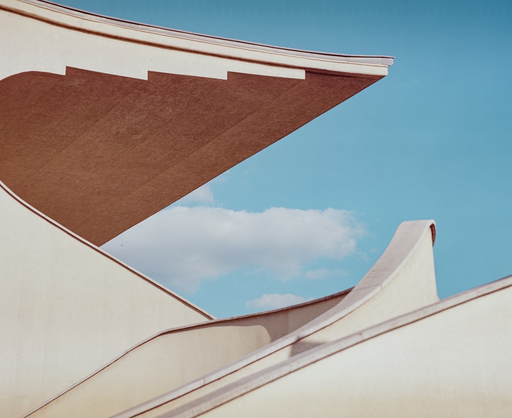 brown and white concrete building under blue sky during daytime