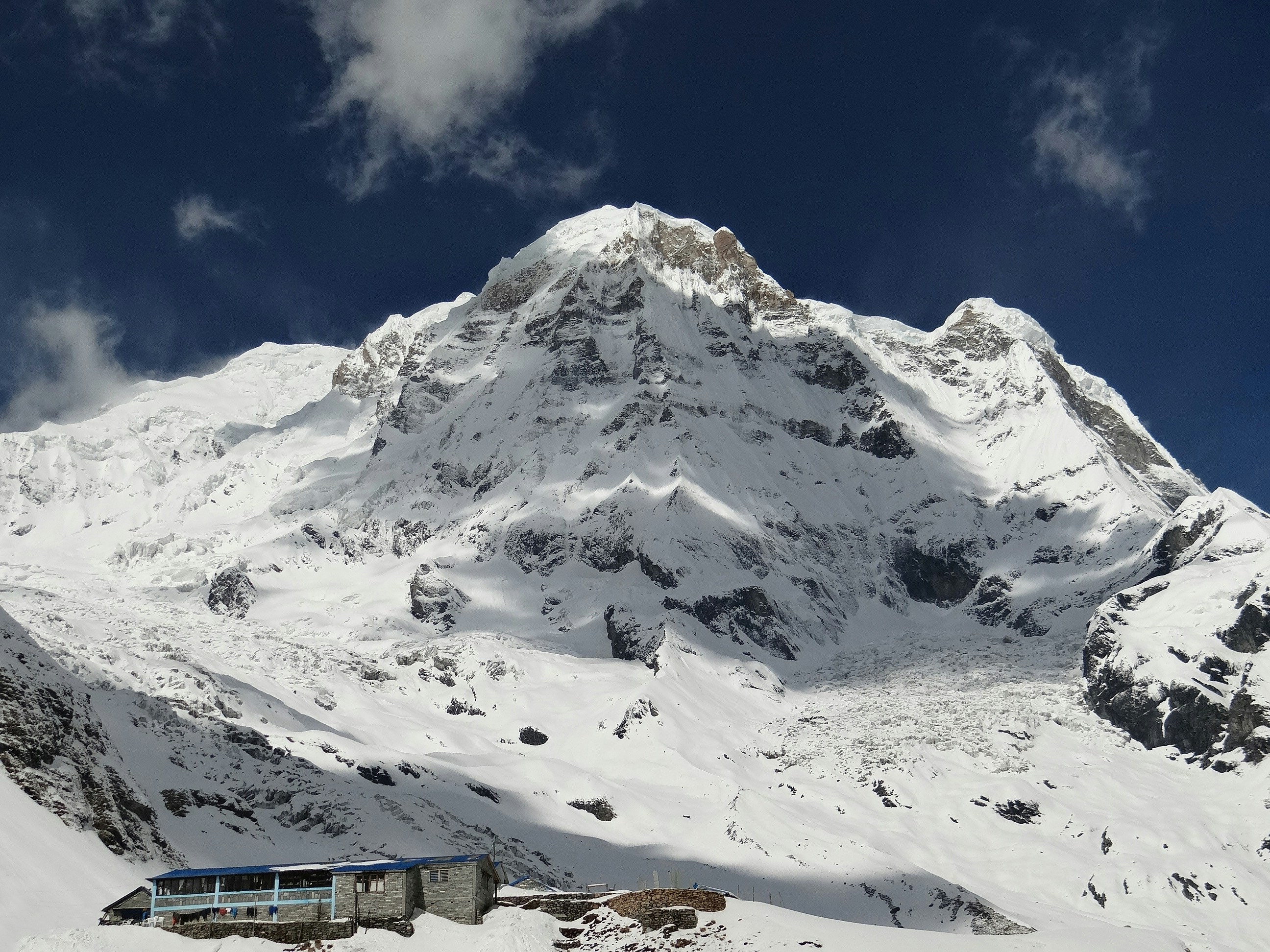 a train traveling through a snow covered mountain