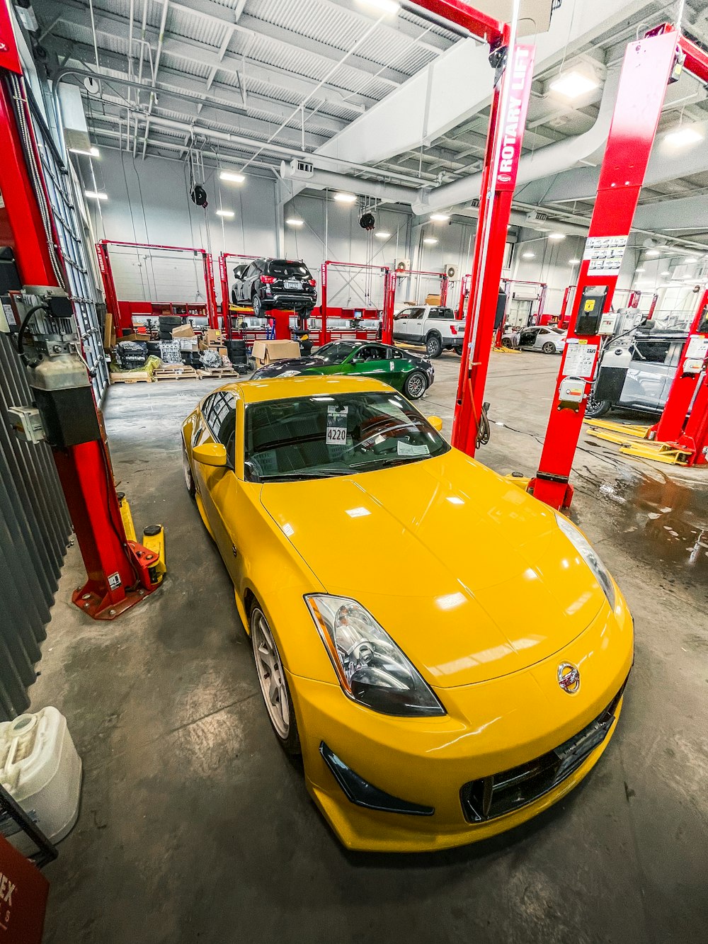 yellow ferrari 458 italia parked inside building