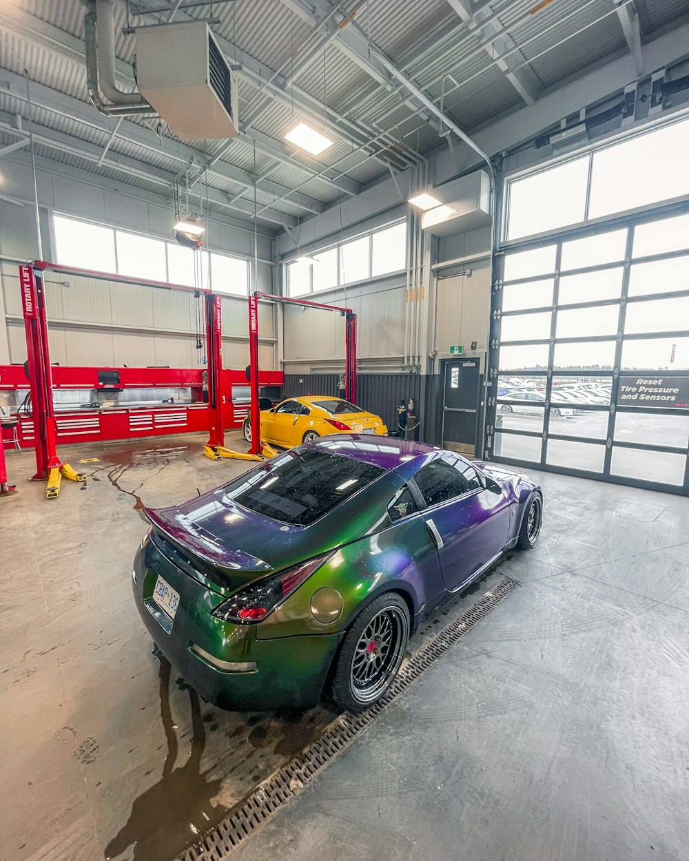 purple chevrolet camaro in garage