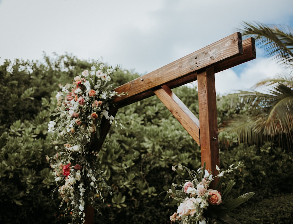 brown wooden fence with white flowers