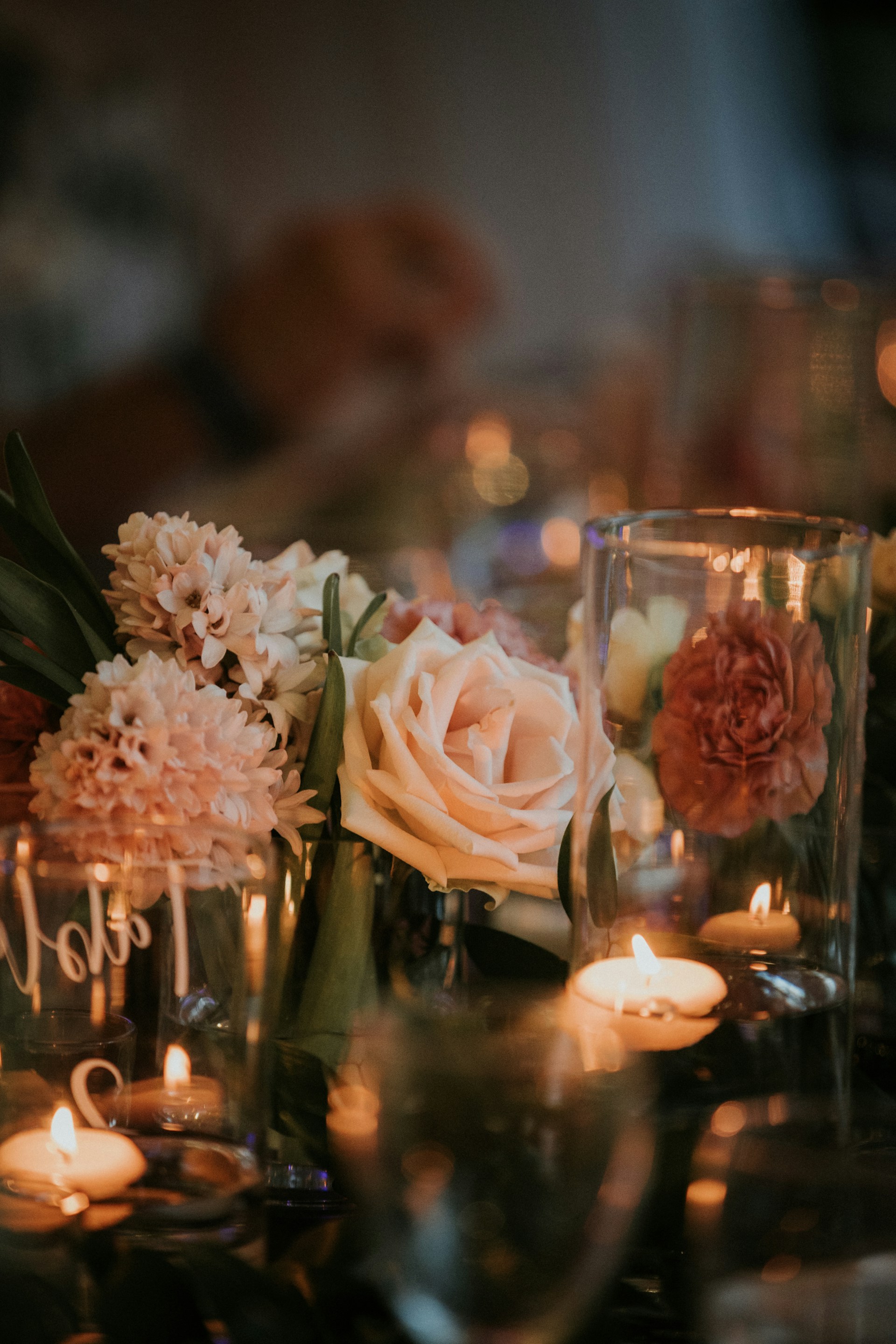 white roses in clear glass vase