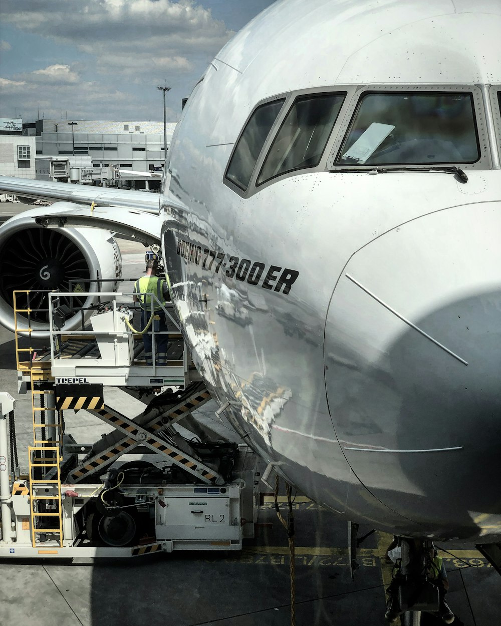 white airplane in a factory