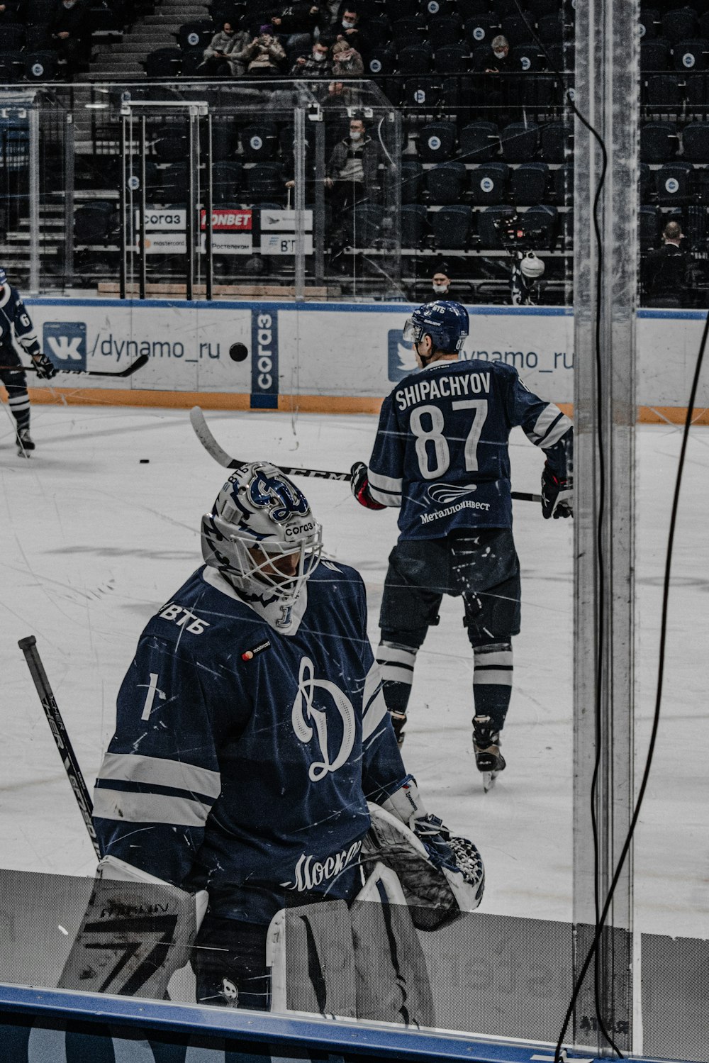 2 men in ice hockey jersey playing ice hockey