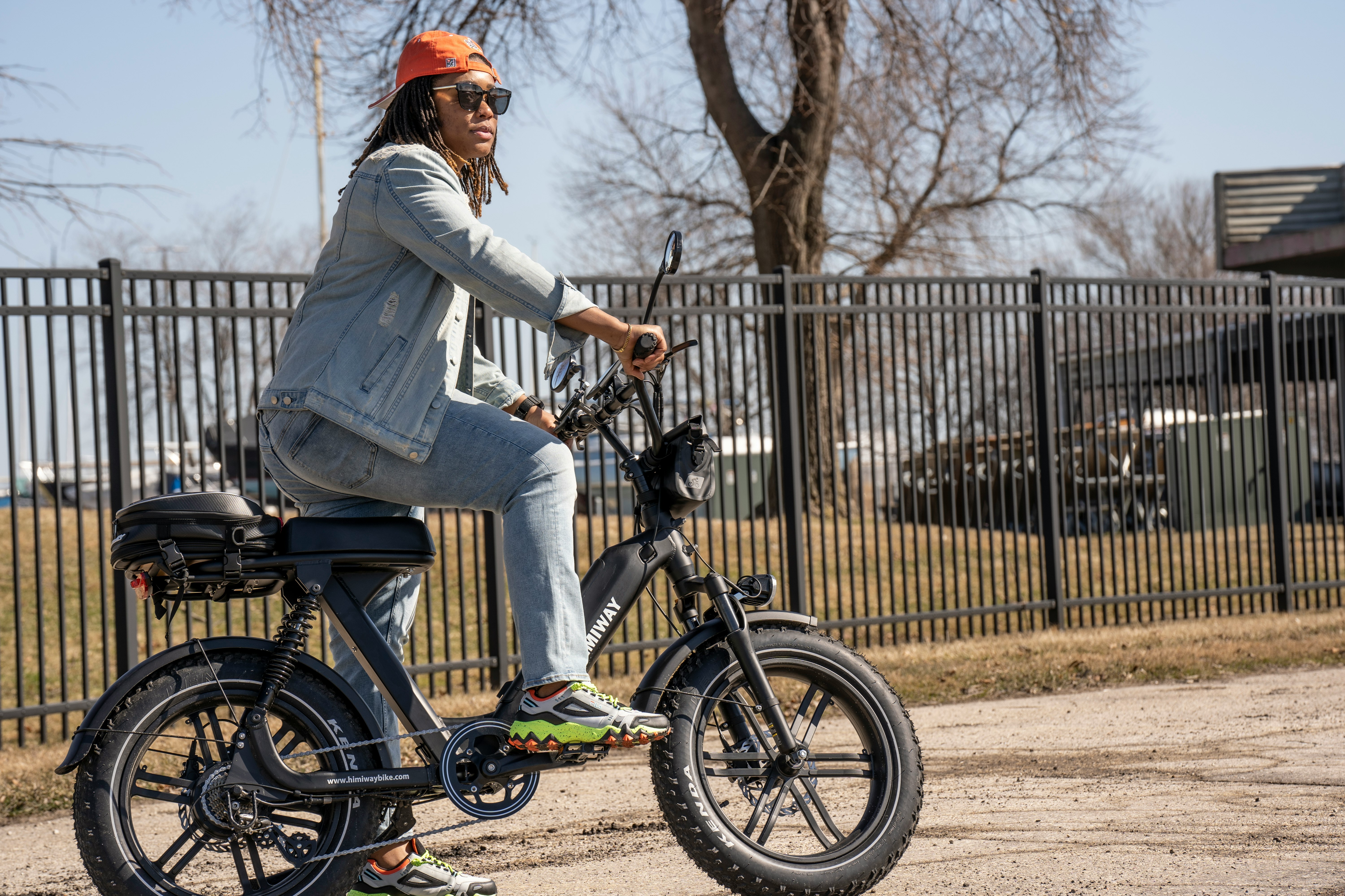 woman in white long sleeve shirt riding green motorcycle