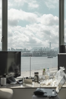 body of water near city buildings during daytime