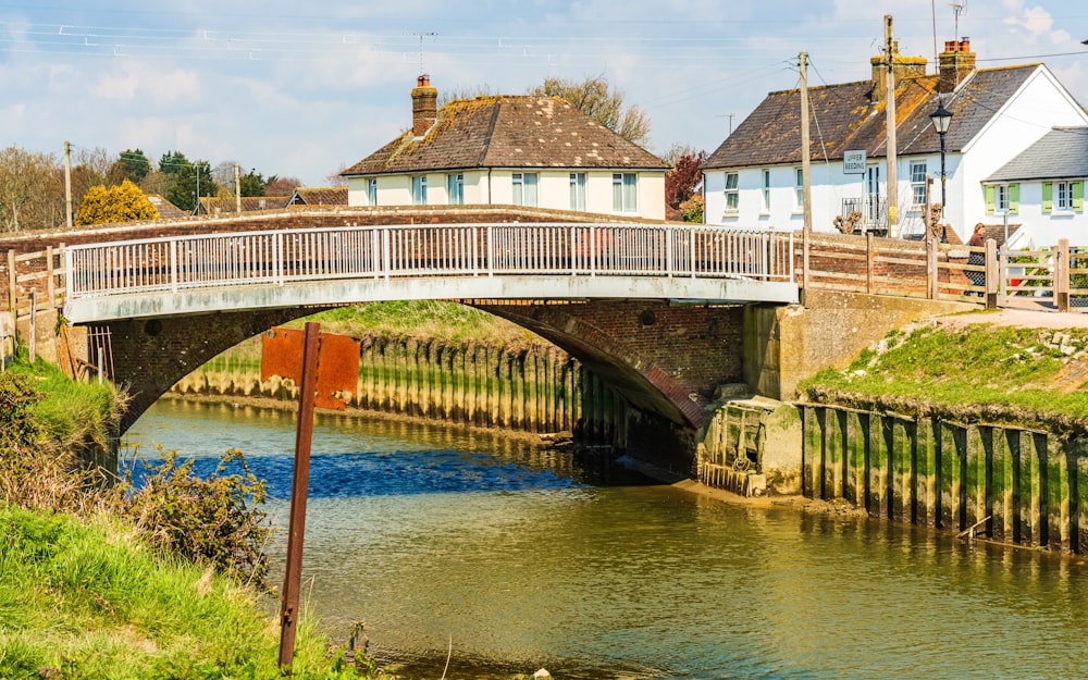 brown and white concrete bridge over river