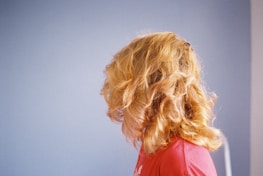 blonde haired woman in red shirt