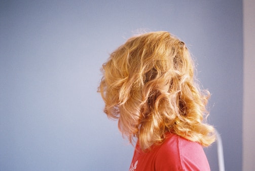 blonde haired woman in red shirt
