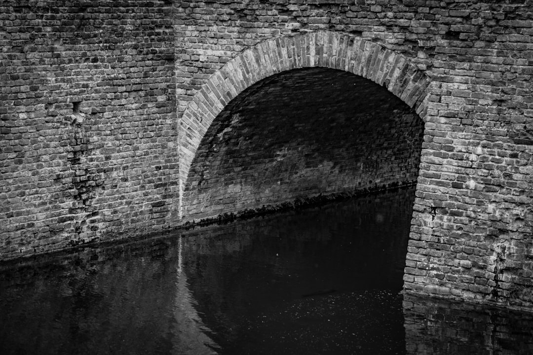 brown brick bridge over river