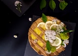 Close-up of a beautifully decorated lemon tart with a golden crust on a rustic wooden table