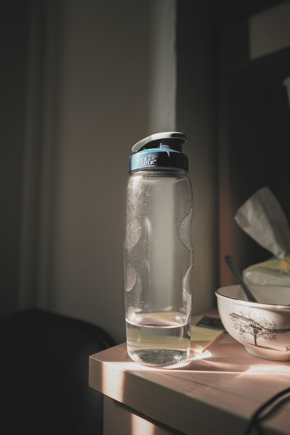 clear glass bottle with water