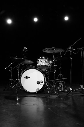 grayscale photo of drum set