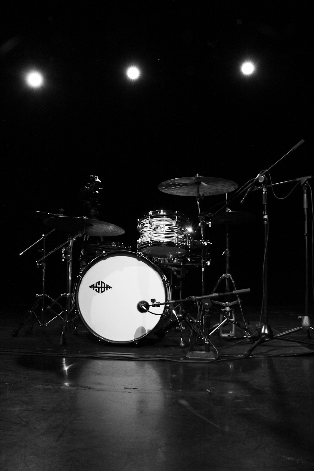 grayscale photo of drum set