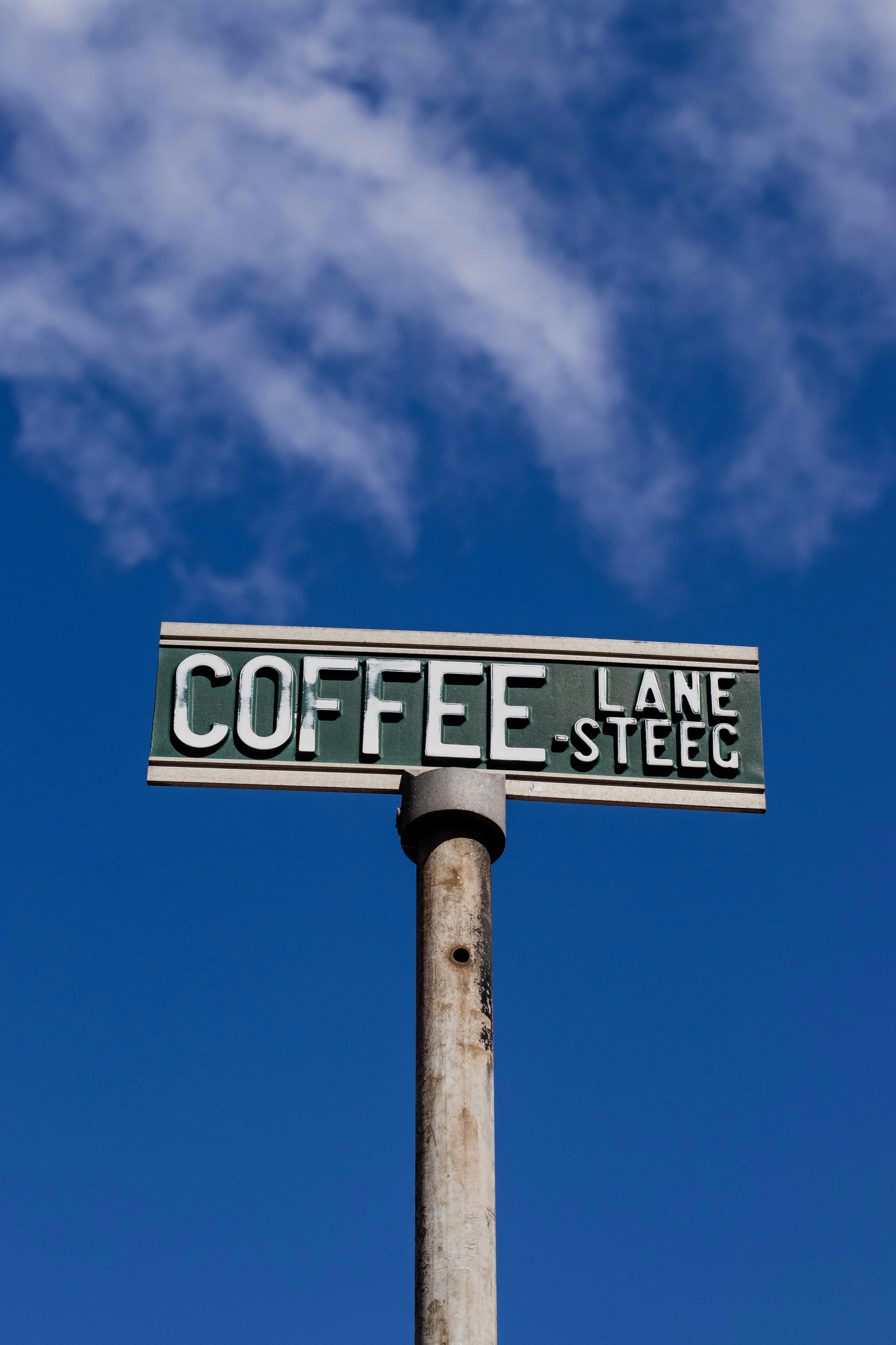 a street sign on top of a metal pole