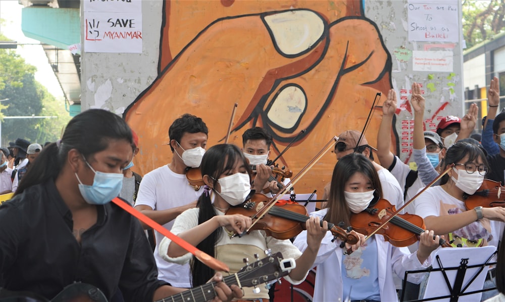 group of people playing musical instruments