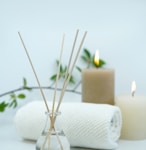 white pillar candle on silver holder
