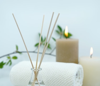 white pillar candle on silver holder