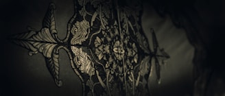 An intricate design showcasing dark floral elements.