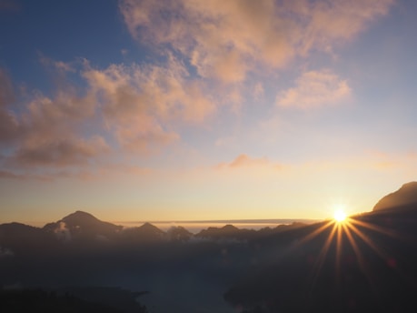 silhouette of mountain under blue sky during daytime