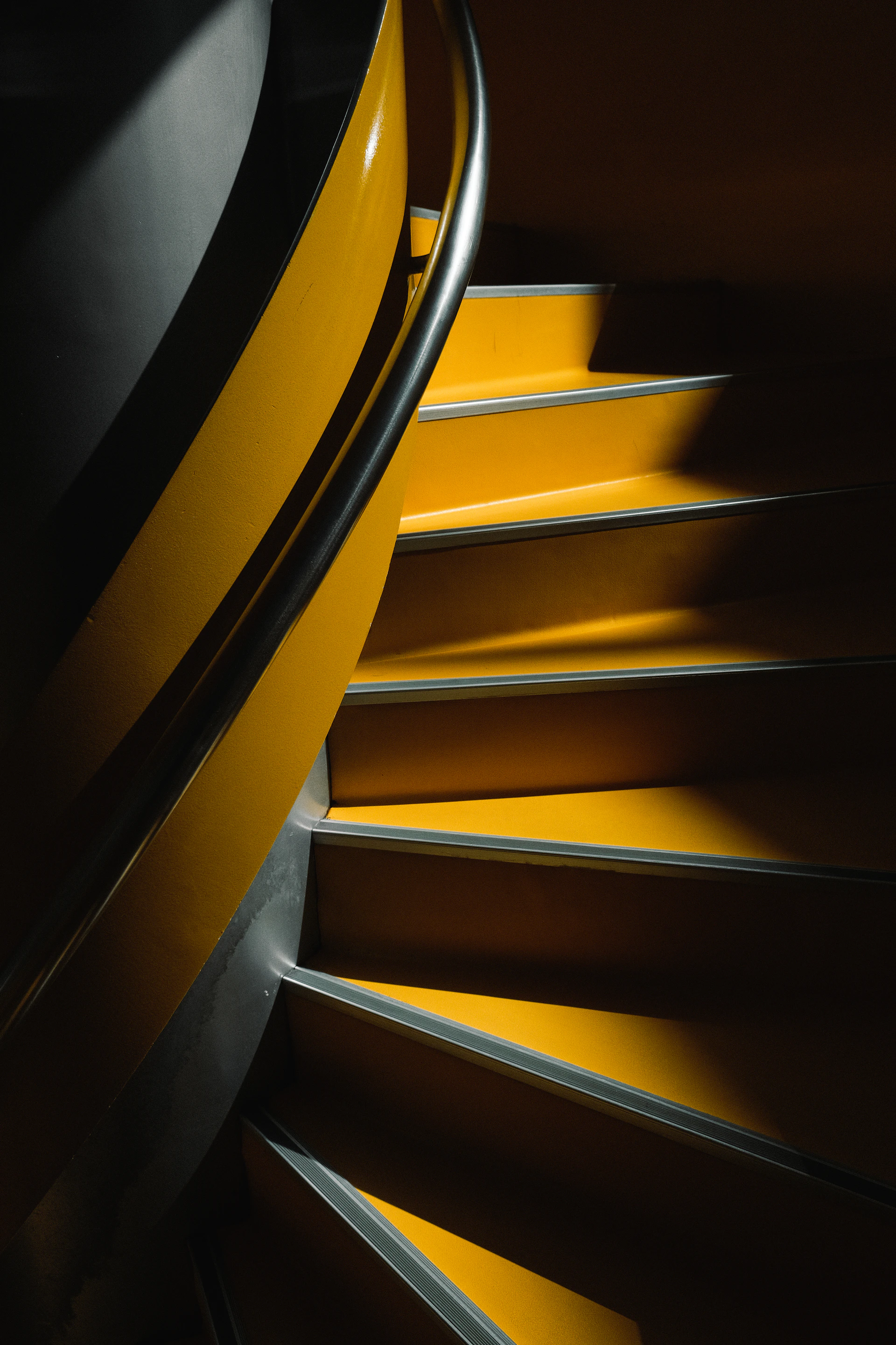 yellow and black spiral staircase