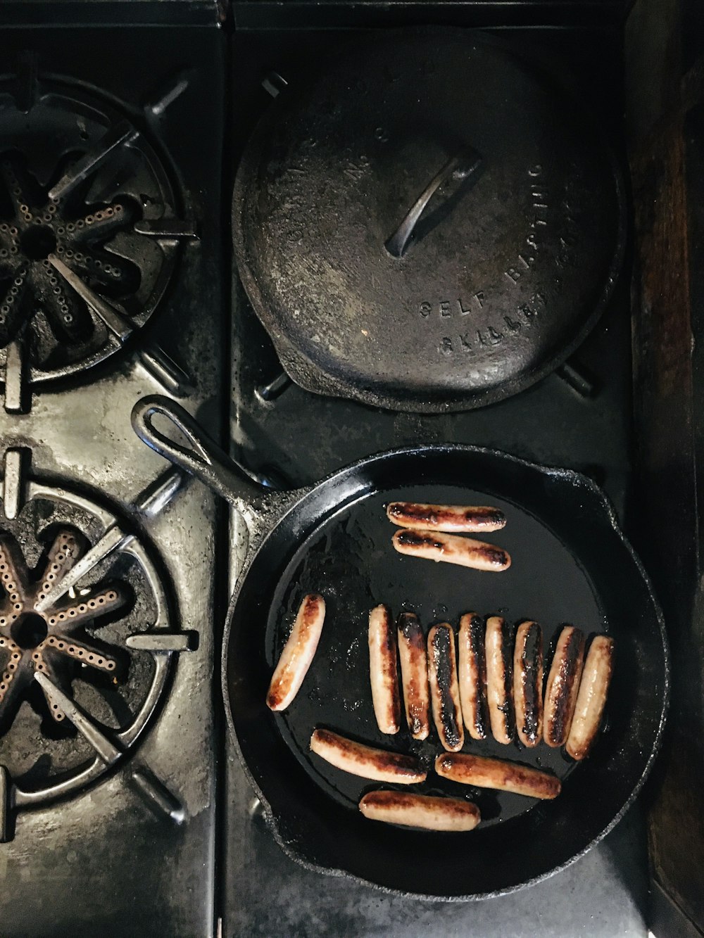 brown sausage on black pan