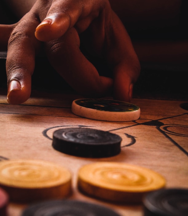 person holding silver and gold coins