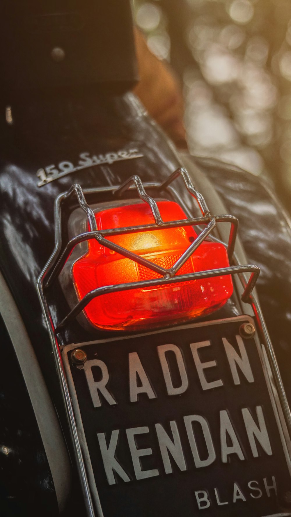 a close up of a red light on a motorcycle