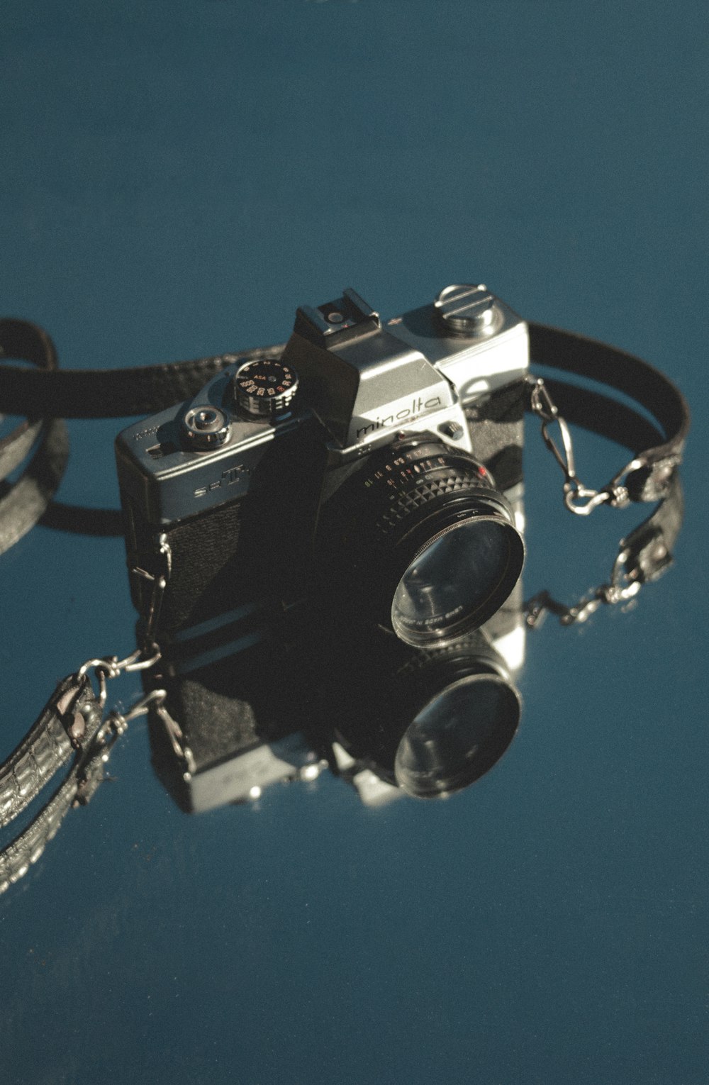 a camera with a chain attached to it