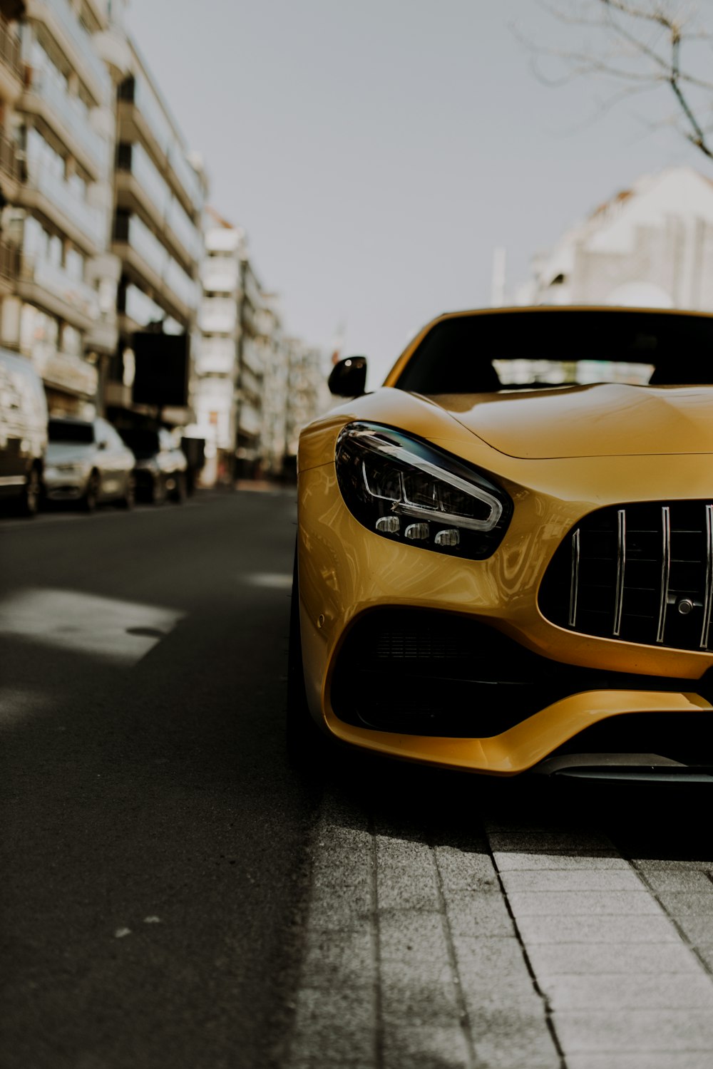 yellow car on the road during daytime