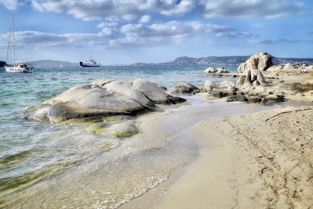 gray rock formation on sea shore during daytime