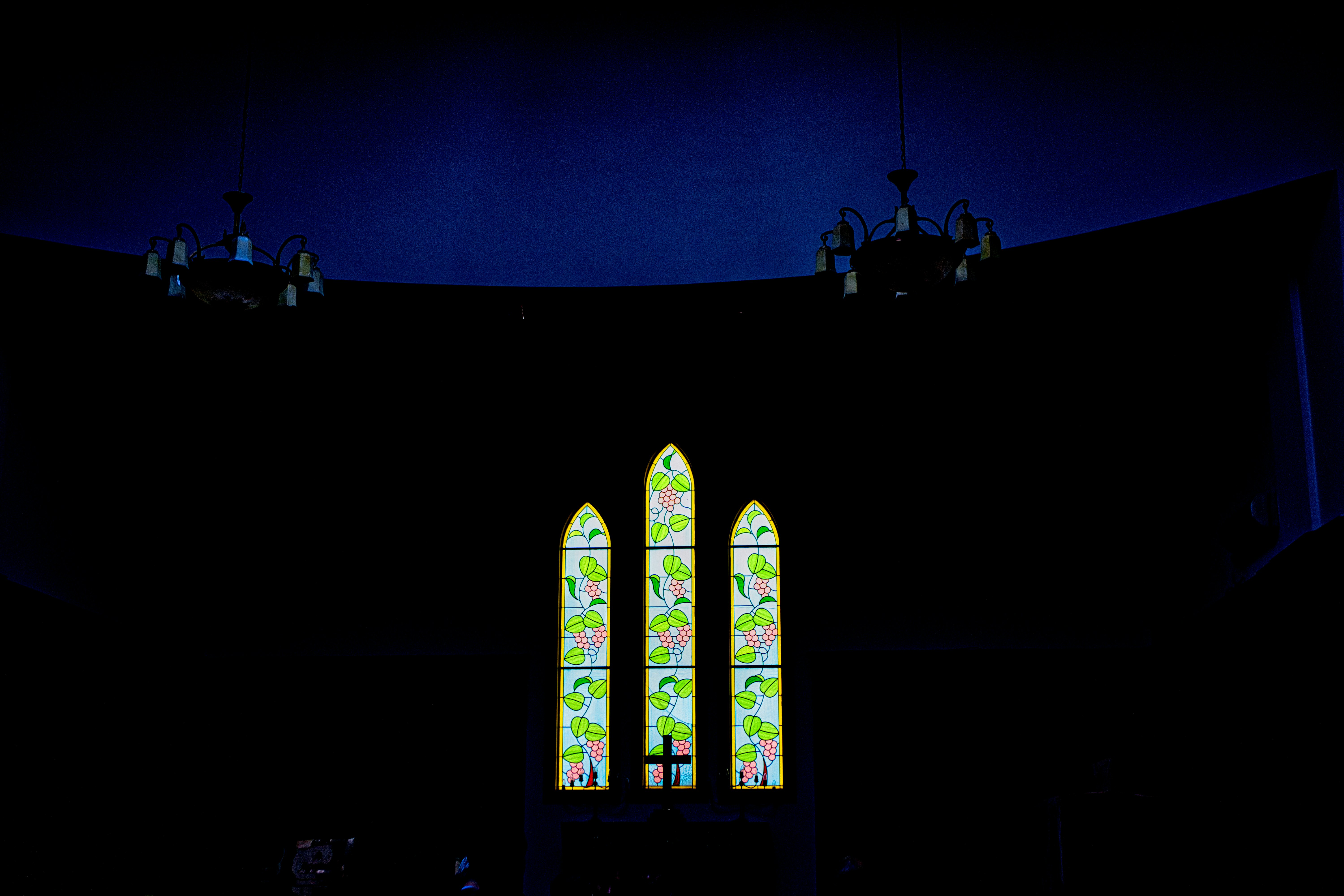 green and black building with glass windows