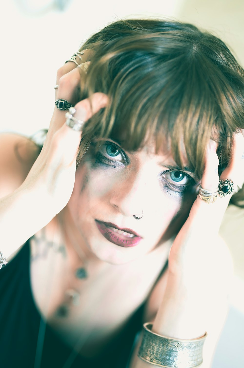 woman in black tank top wearing silver ring