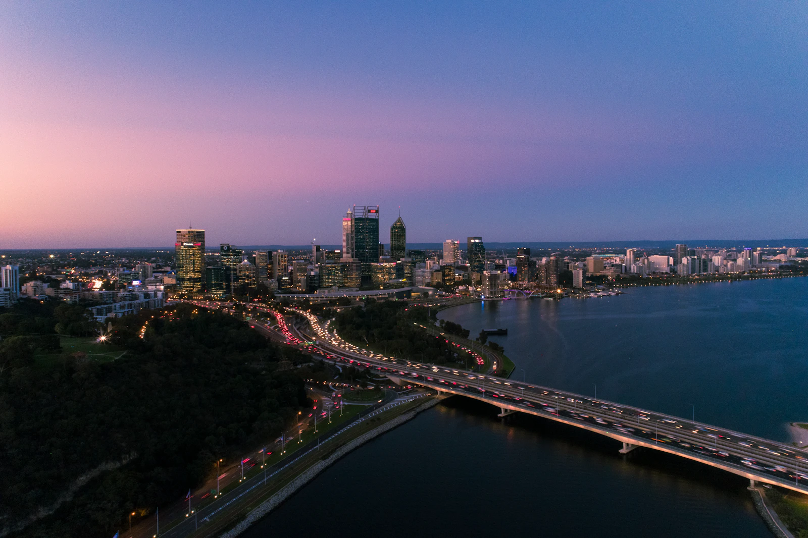 Perth city skyline at dusk over the Swan River