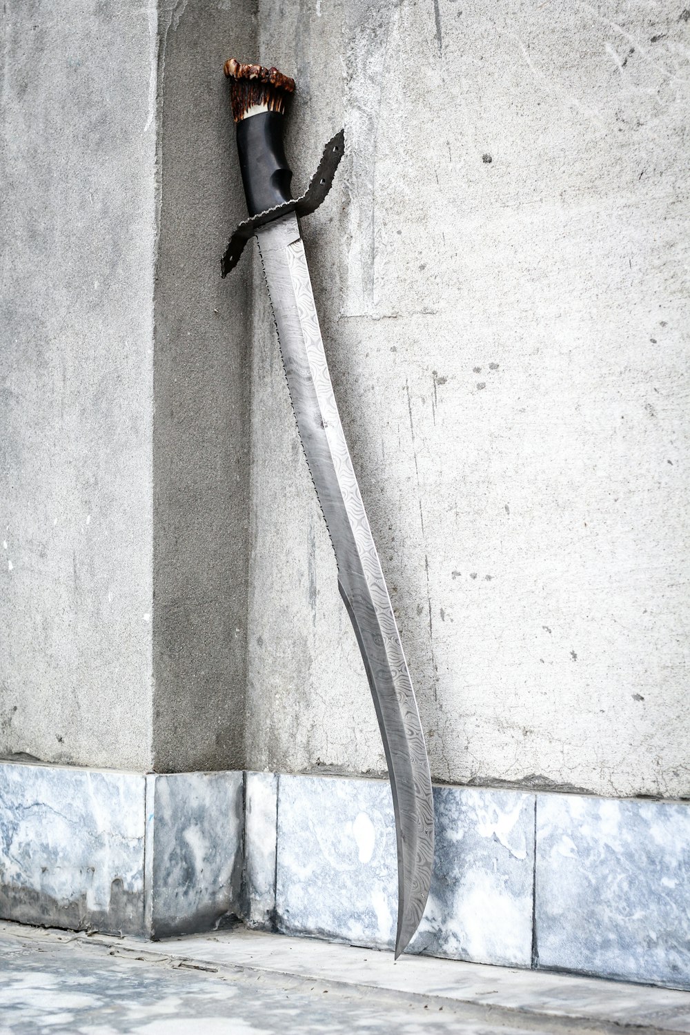 black and white rope on white concrete wall