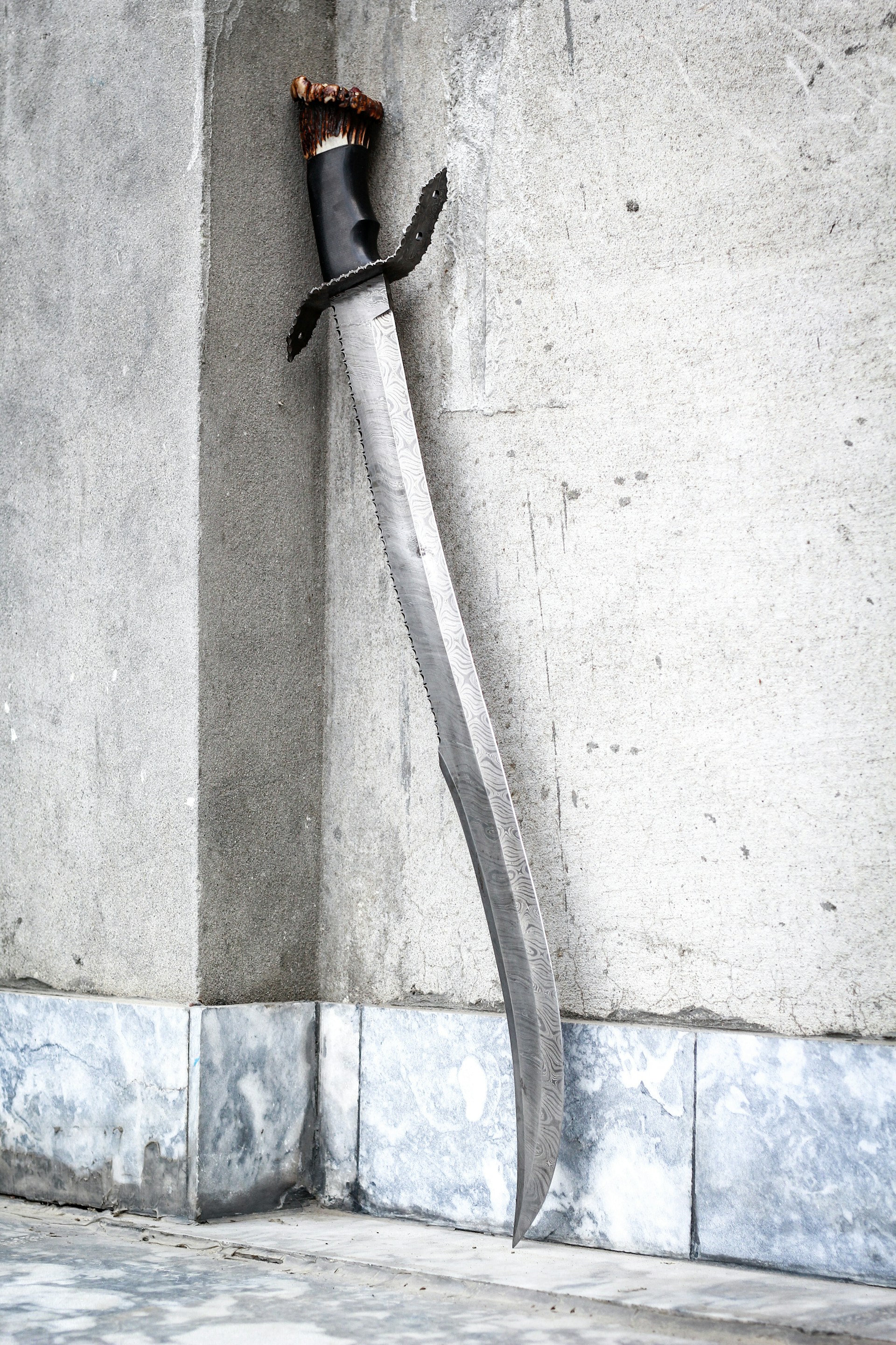 black and white rope on white concrete wall