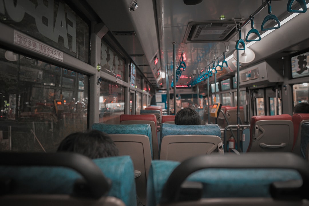 people sitting on bus seat