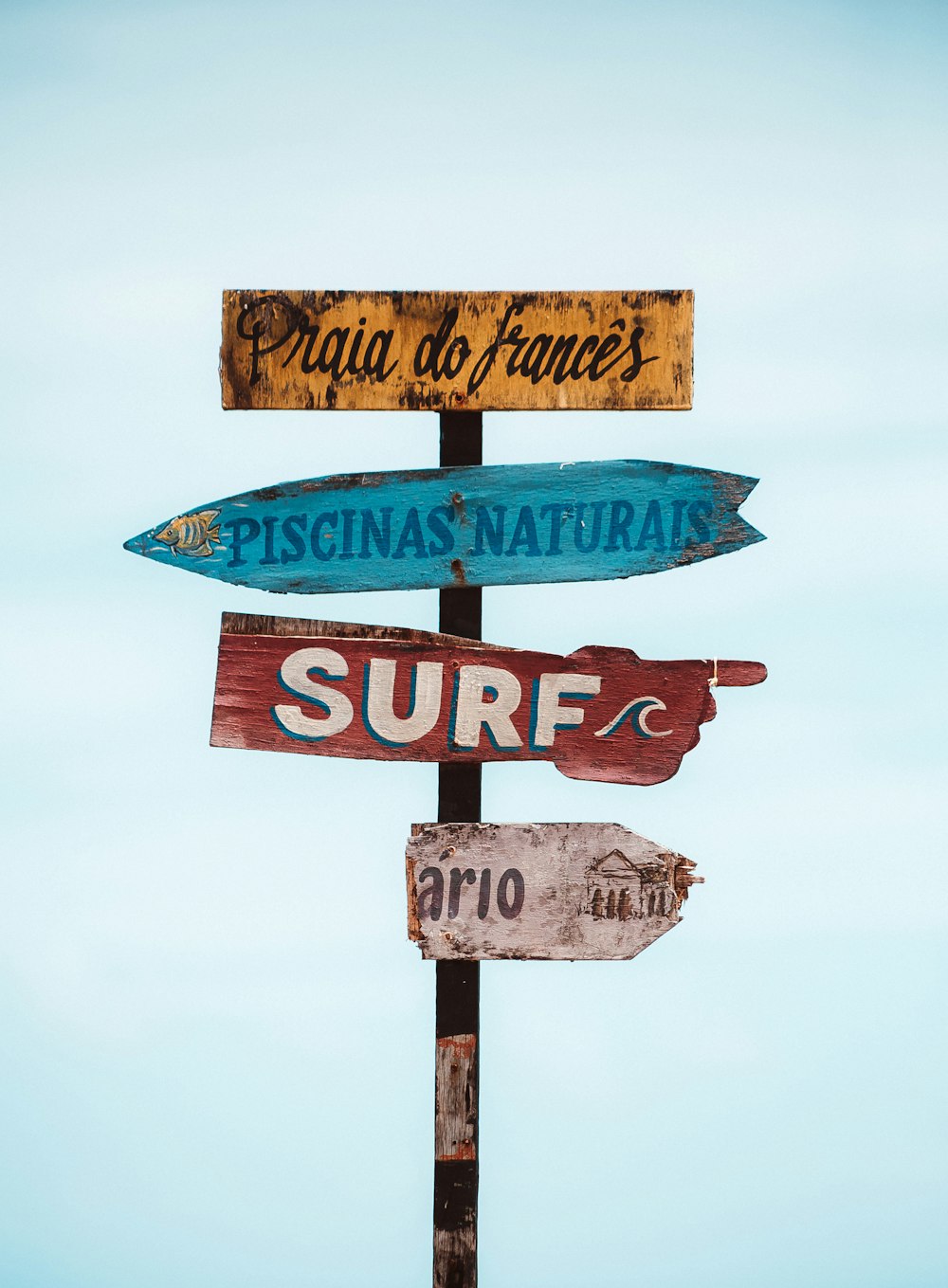 blue and brown street sign