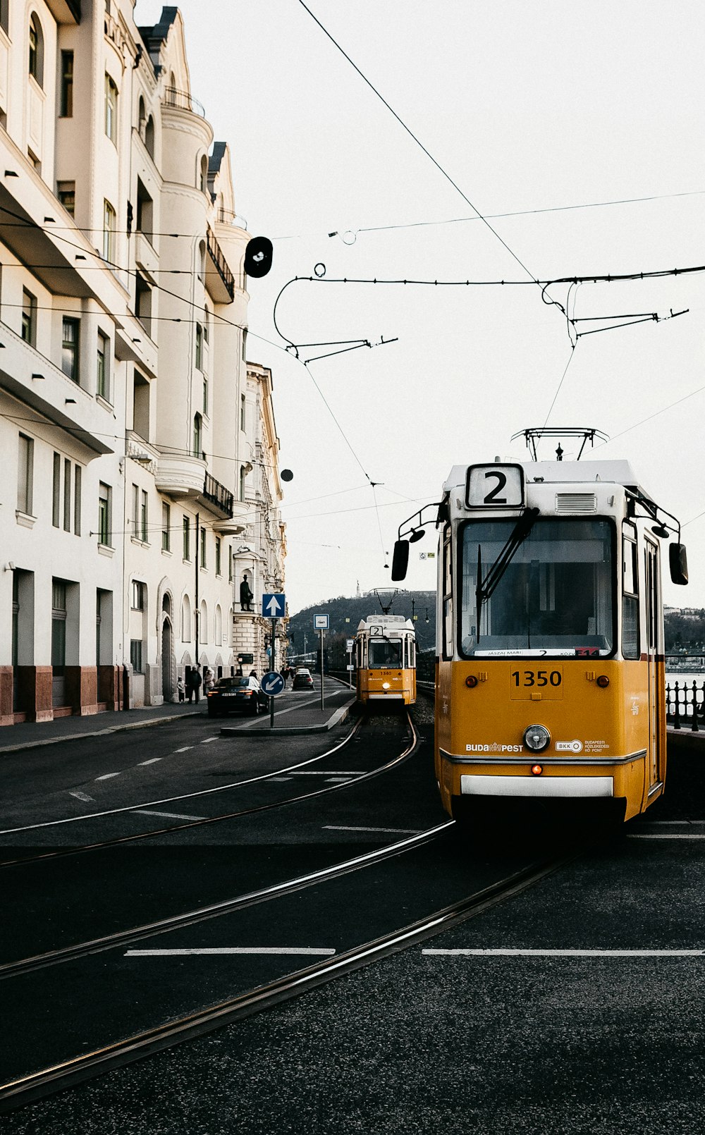 yellow and white tram on road during daytime