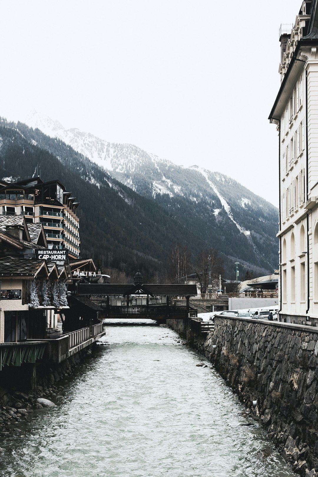 brown and white concrete building near body of water during daytime