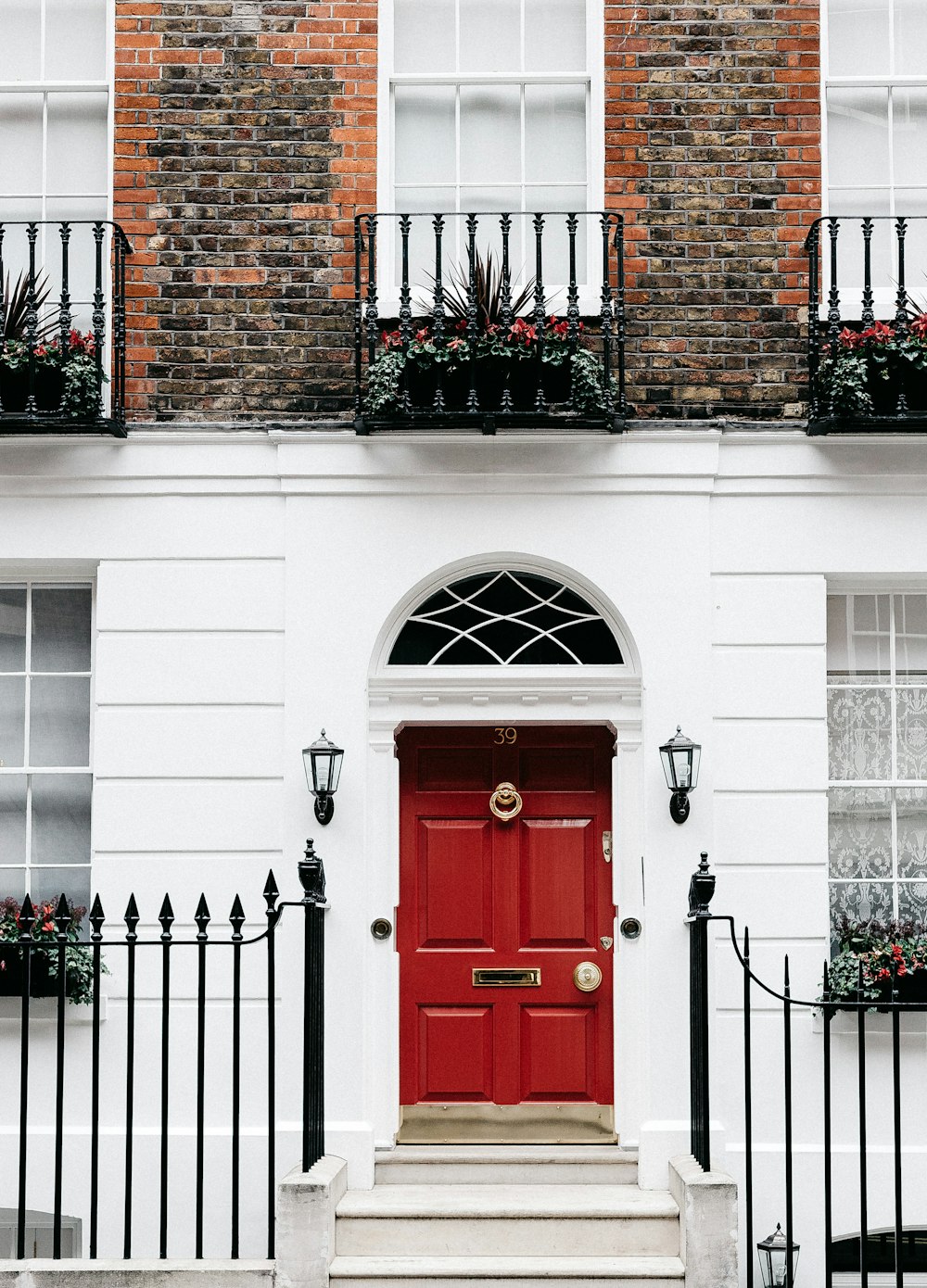 red wooden door on brown brick building