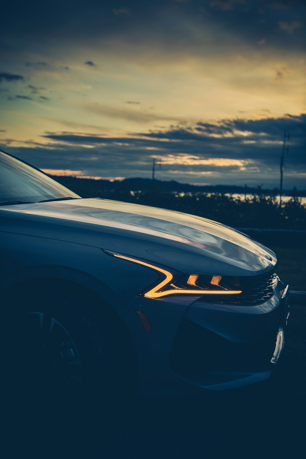 black car on road during sunset