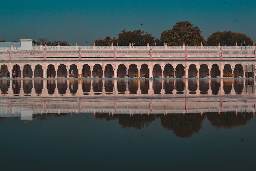 white concrete building near body of water during daytime