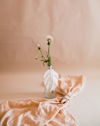 white flower on white textile