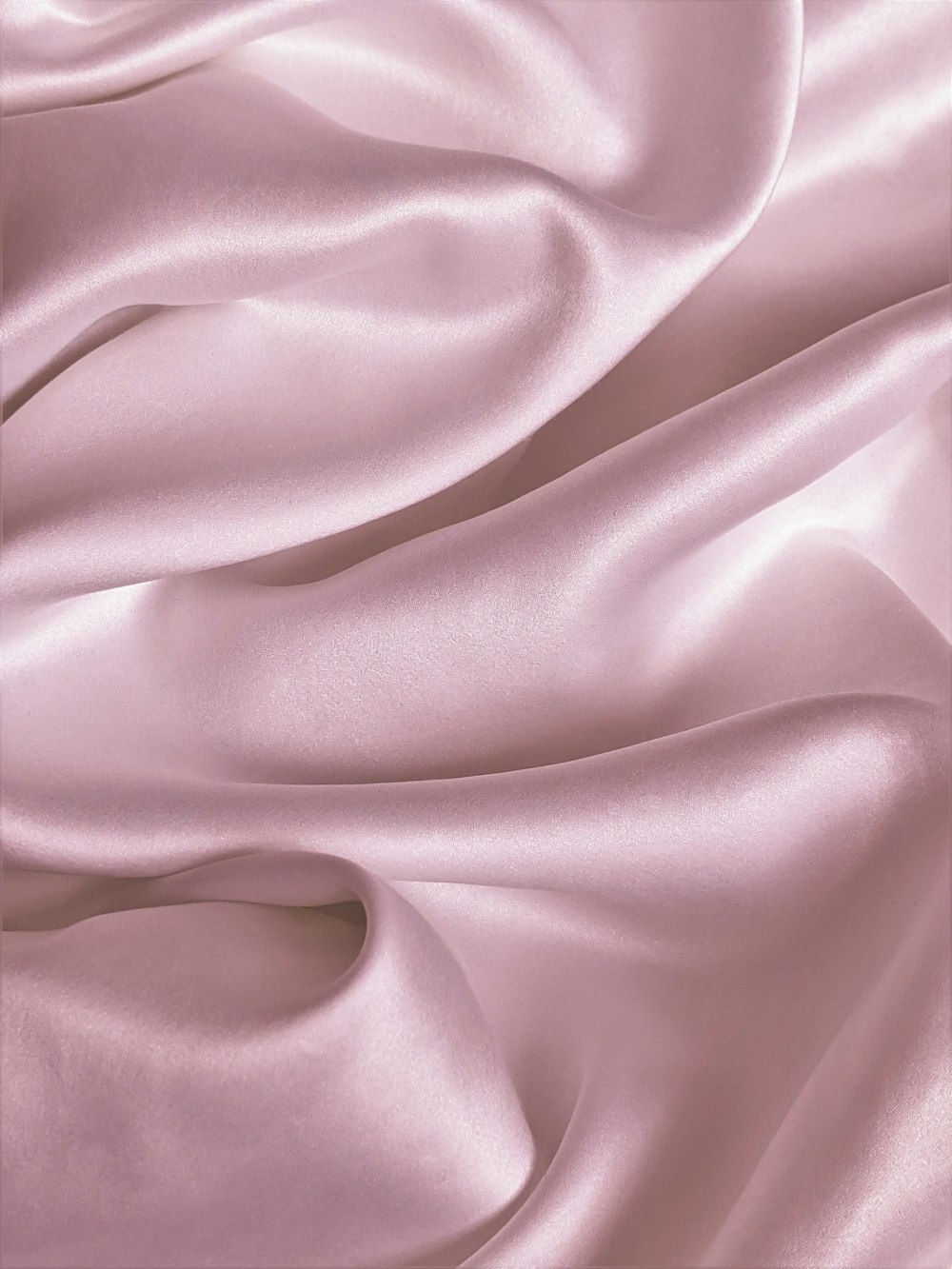 pink textile in close up photography