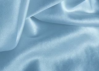 blue textile on white textile