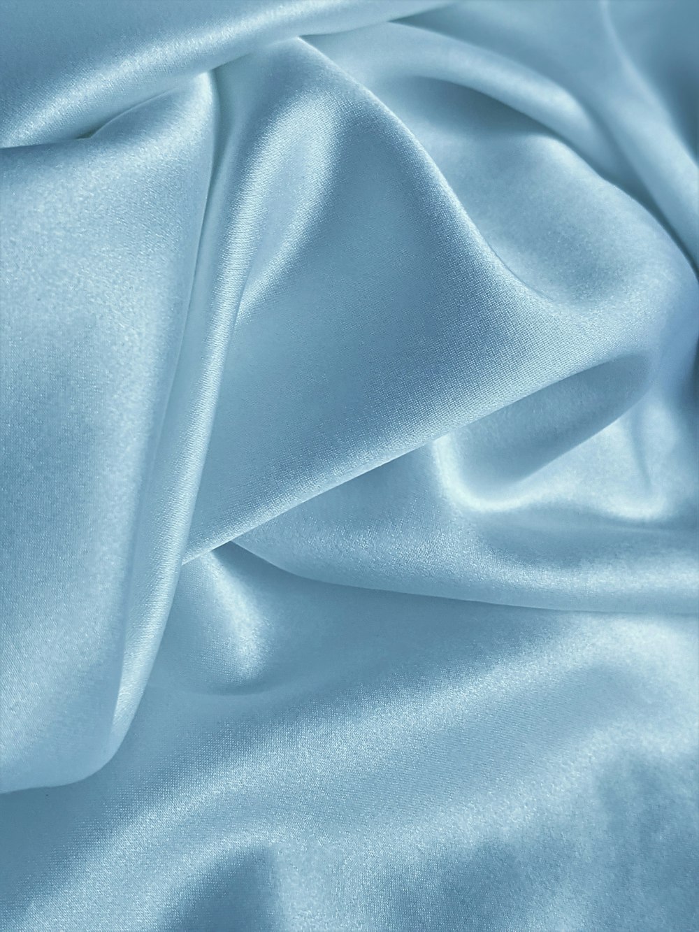 blue textile on white textile